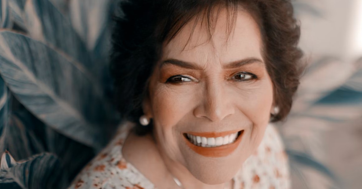 woman smiling with dental implant in lansing, mi